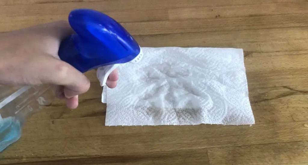 kitchen roll sprayed with cleaning product