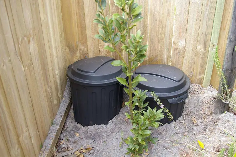 half buried compost bins